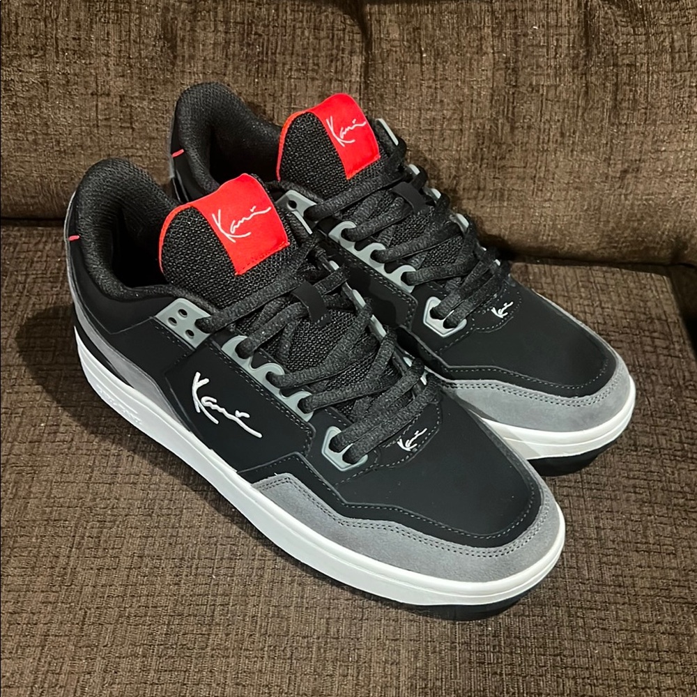 Karl Kani Stylish Black and Gray Men's Sneakers with suede trim.